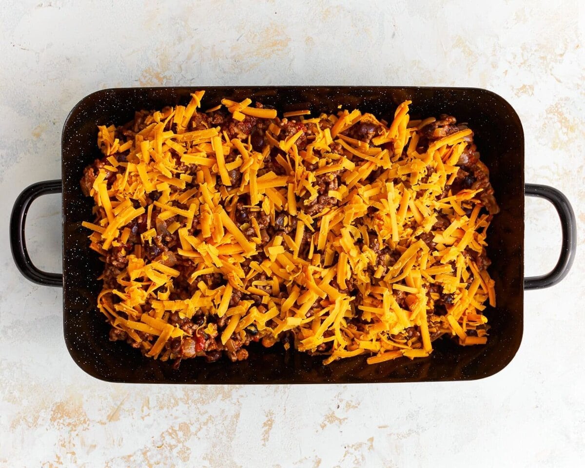 Layering the ingredients for the casserole.