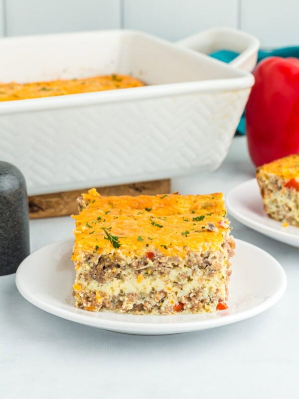 one piece of egg and sausage casserole on a white plate