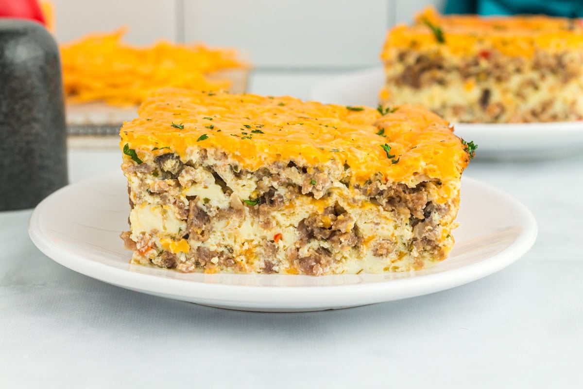 side view of piece of breakfast casserole on white plate