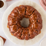 overhead view of monkey bread on white cake platter