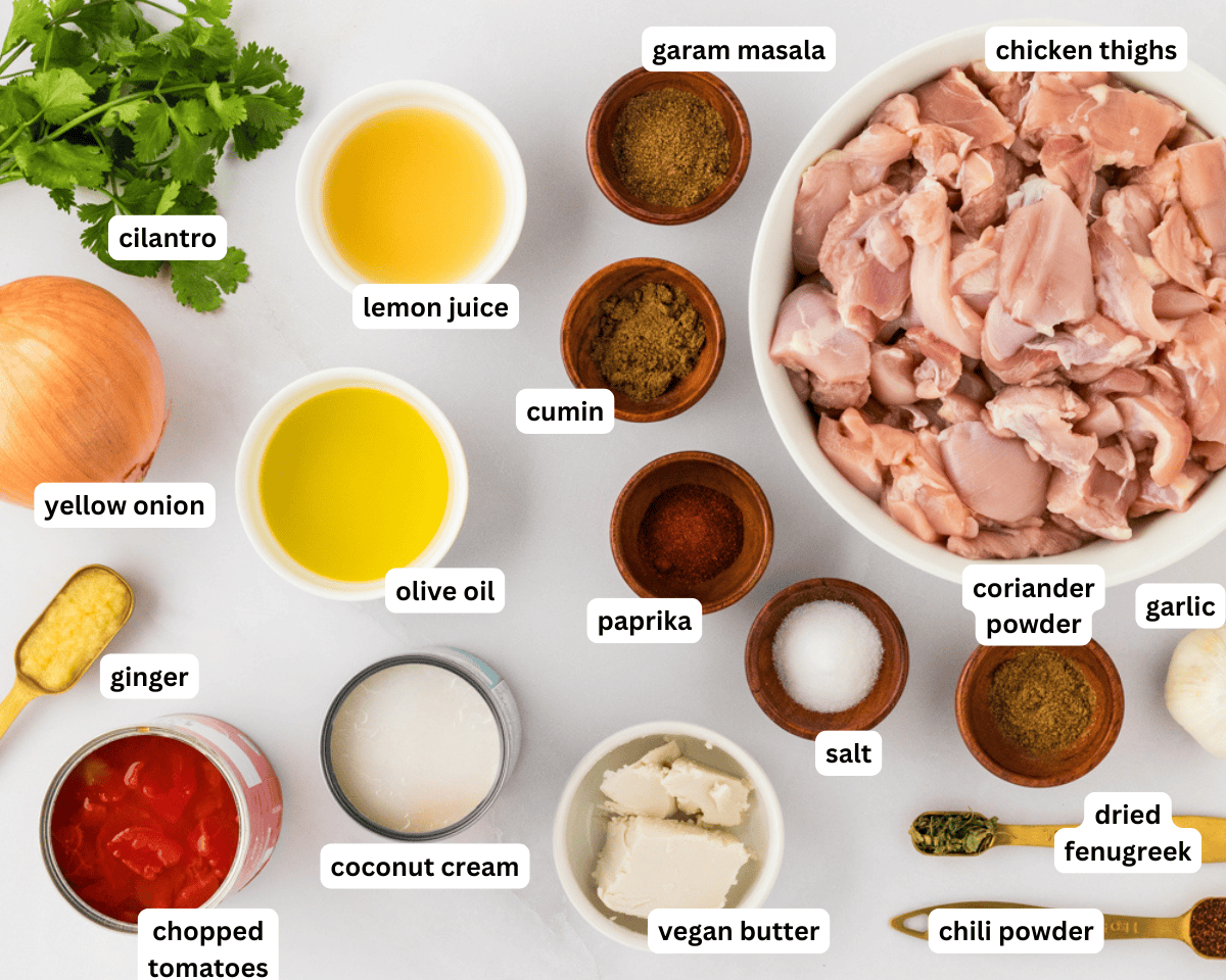ingredients for dairy-free butter chicken measured and prepped on a countertop