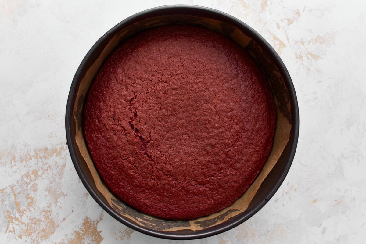 Baked gluten-free red velvet cake layer in a baking pan 