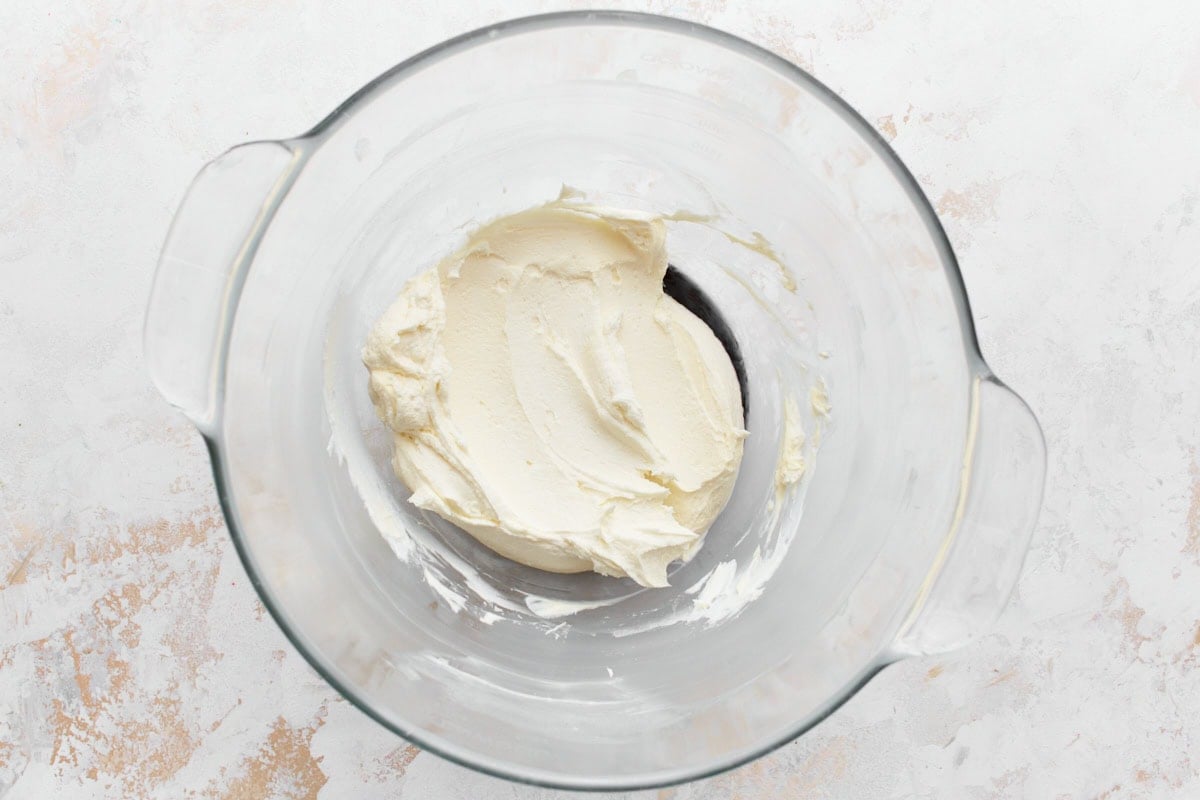 Cream cheese and butter creamed together in a glass bowl