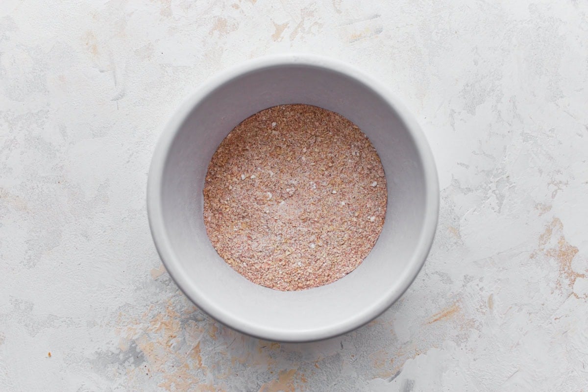 gluten-free chicken wing spice rub in a white bowl on a light surface