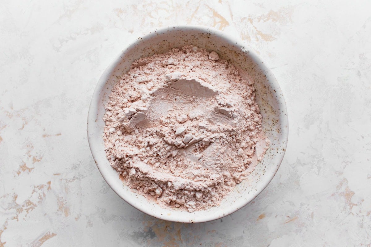 gluten-free flour and cocoa powder mixture in a white bowl