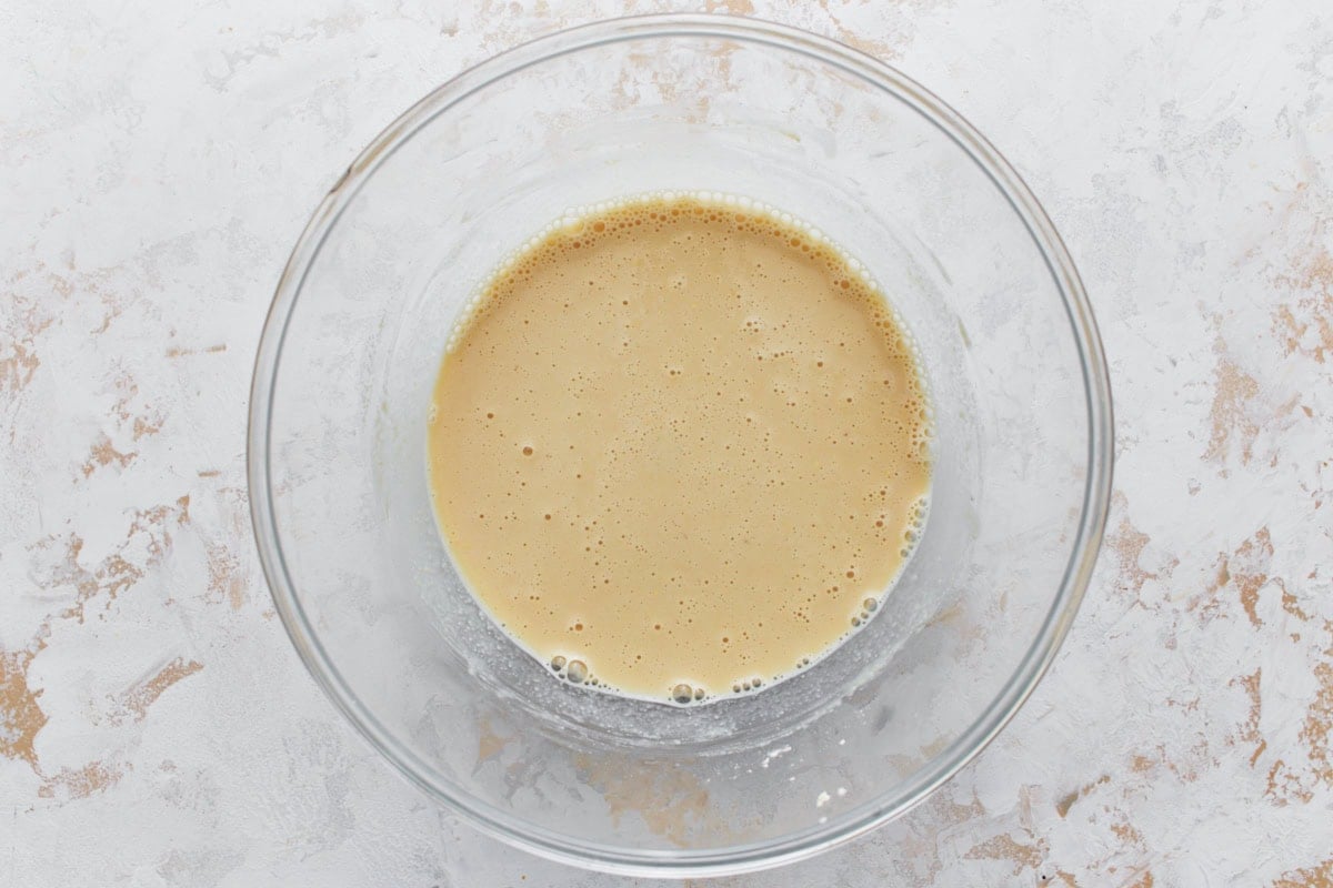 A bowl with chickpea batter, smooth and creamy in consistency.