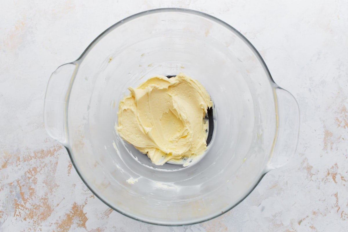 A bowl with butter that has been thoroughly whipped to a light and fluffy consistency.