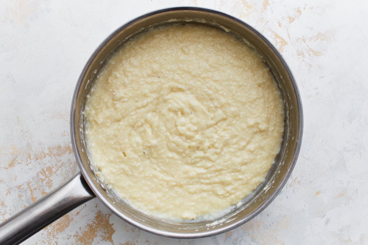 Finished thickened custard with coconut stirred in, ready to pour into crust.