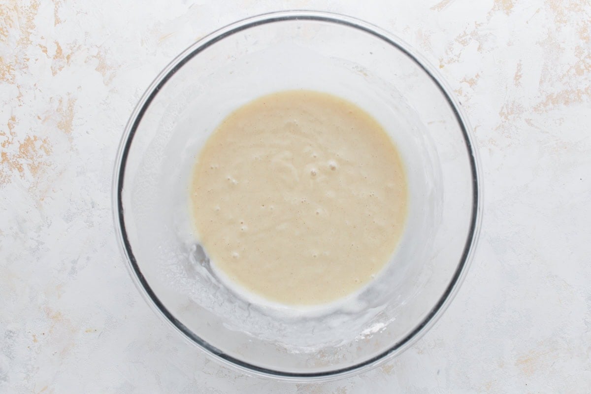 Bowl of smooth cobbler batter ready to be poured into the baking dish.