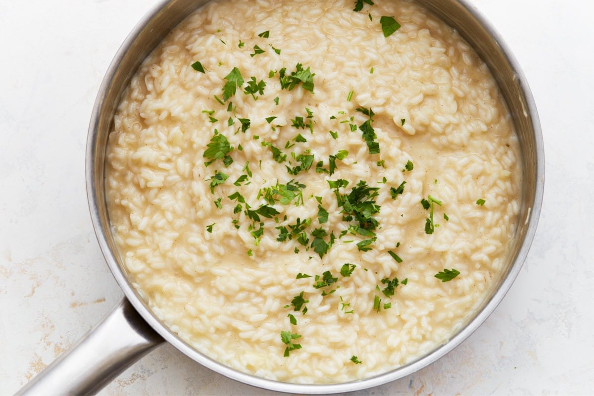 Finished gluten-free risotto garnished with fresh parsley, ready to serve.