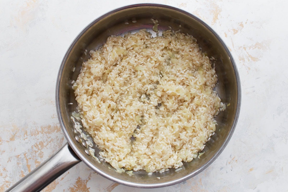 Arborio rice toasted with white wine deglazing the pan
