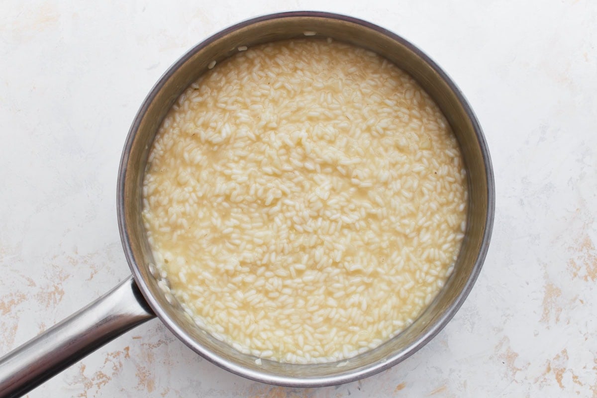 Nearly finished risotto with a smooth, creamy texture in the pan.
