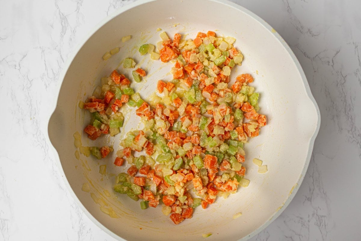Carrots, celery, and onions coated in gluten-free flour to create the roux base.