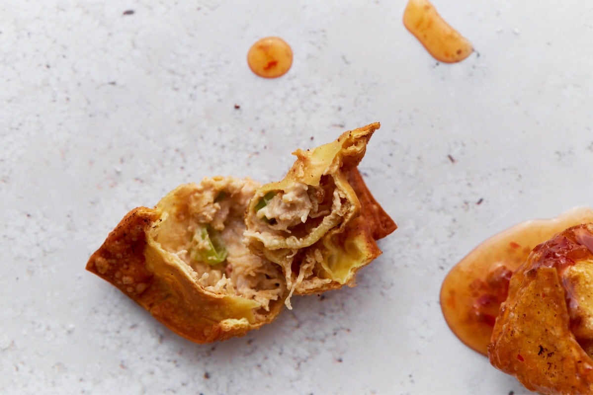 gluten free crab rangoon cooked and a bite taken out of to see the inside