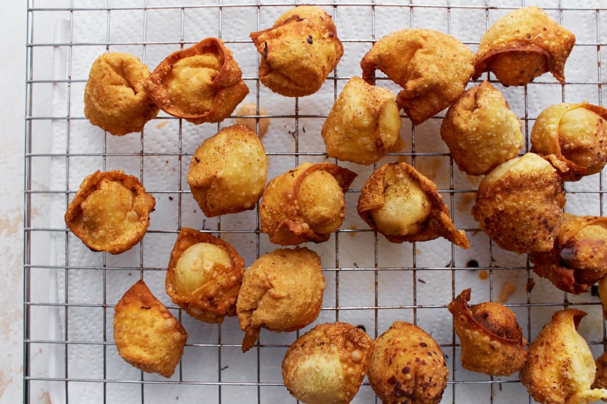 gluten free crab rangoons fried up on a wire rack