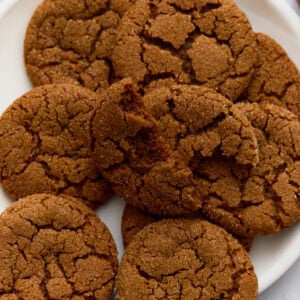 A plate of gluten-free gingersnaps with crisp, crackled tops.