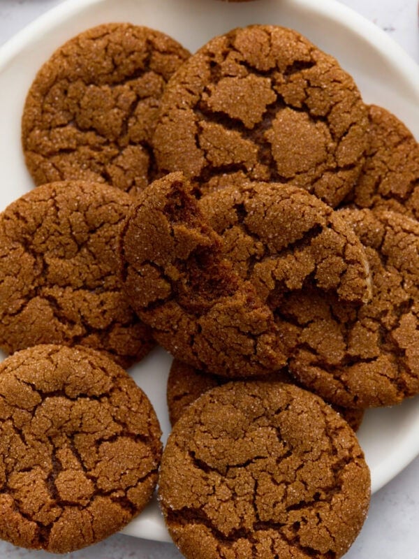 A plate of gluten-free gingersnaps with crisp, crackled tops.