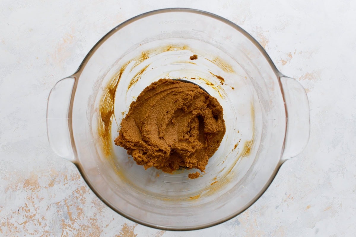 Creamed butter and sugar in a glass mixing bowl.