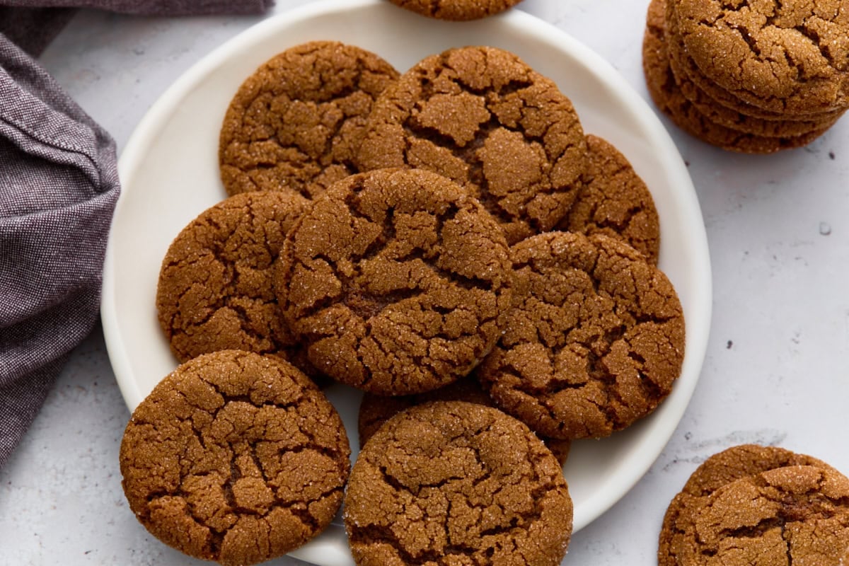Gluten-free gingersnaps stacked on a plate, ready to serve.