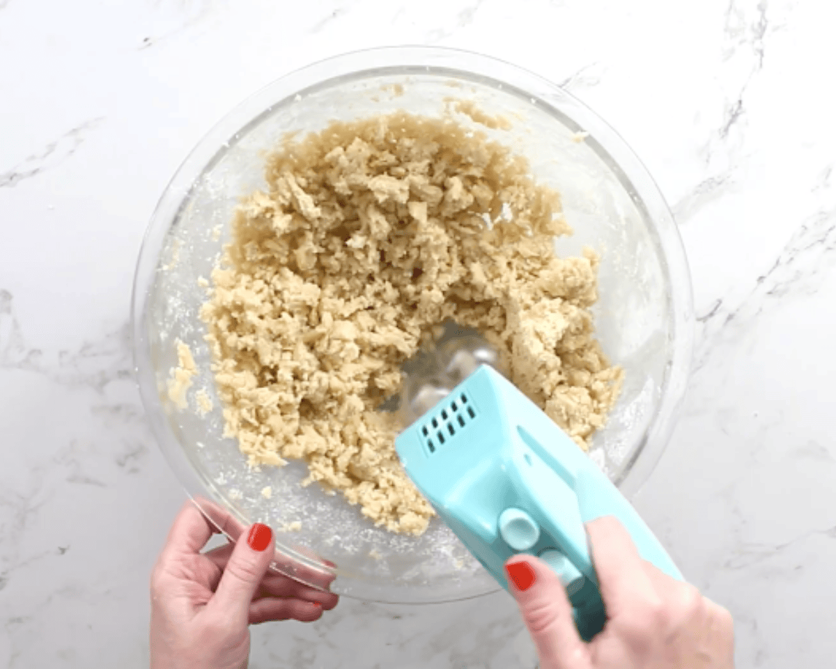 mixing the batter for gluten-free thumbprint cookies