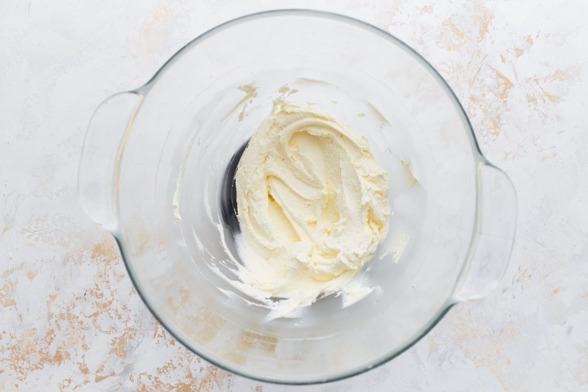 Creamy vanilla buttercream filling whipped smooth in a glass bowl.
