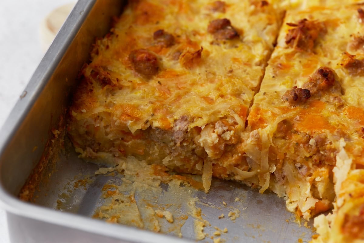 baked gluten-free breakfast casserole in baking dish with a slice taken out