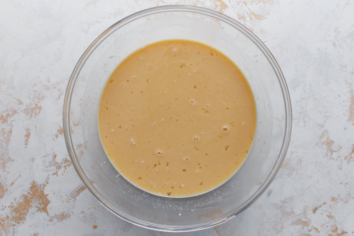 bisquick, brown sugar, pepper, milk and eggs being combined to make gluten-free breakfast casserole