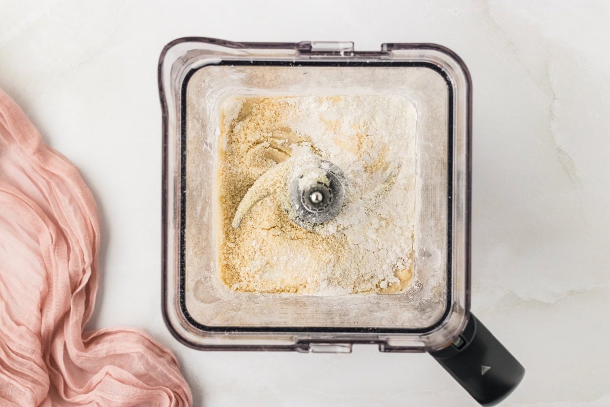 Dry ingredients for almond flour crepes added to a blender before mixing