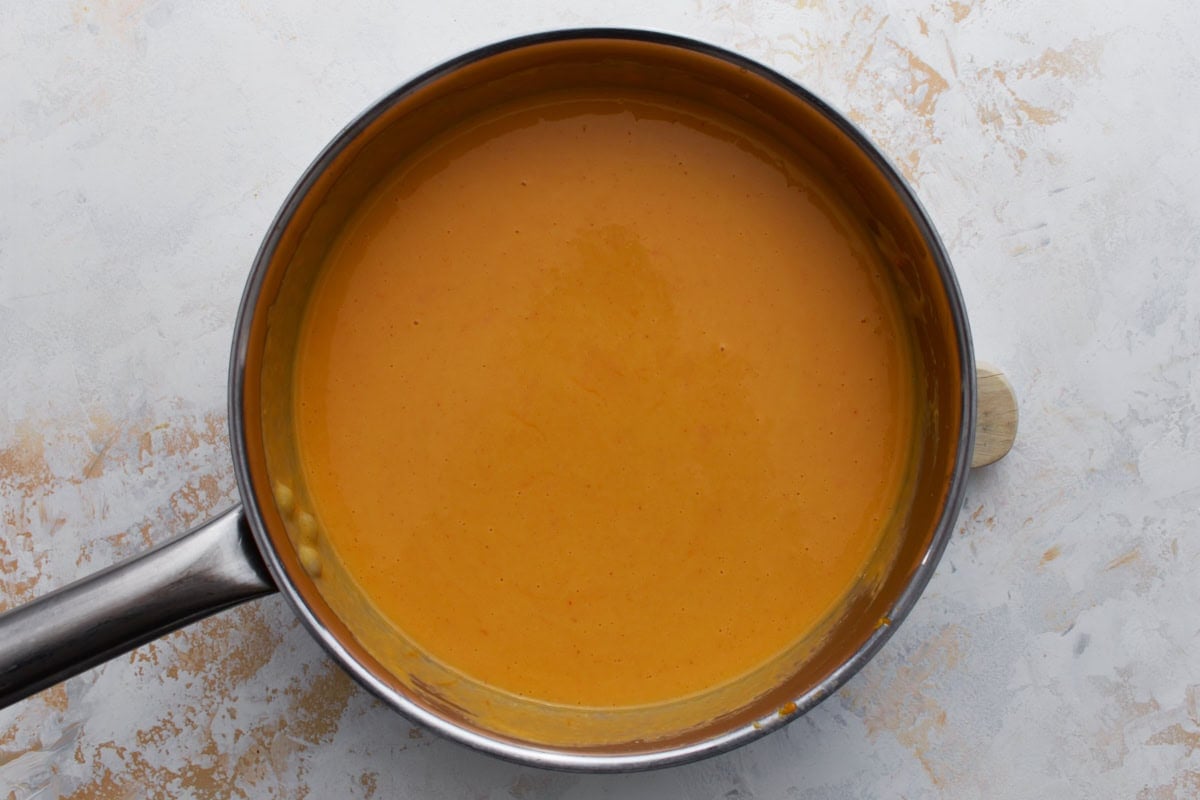 finished gluten-free beer cheese sauce in a saucepan