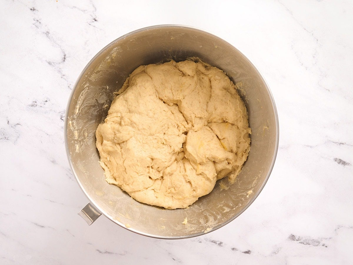 Proofed gluten free challah bread dough after rising in the mixing bowl.
