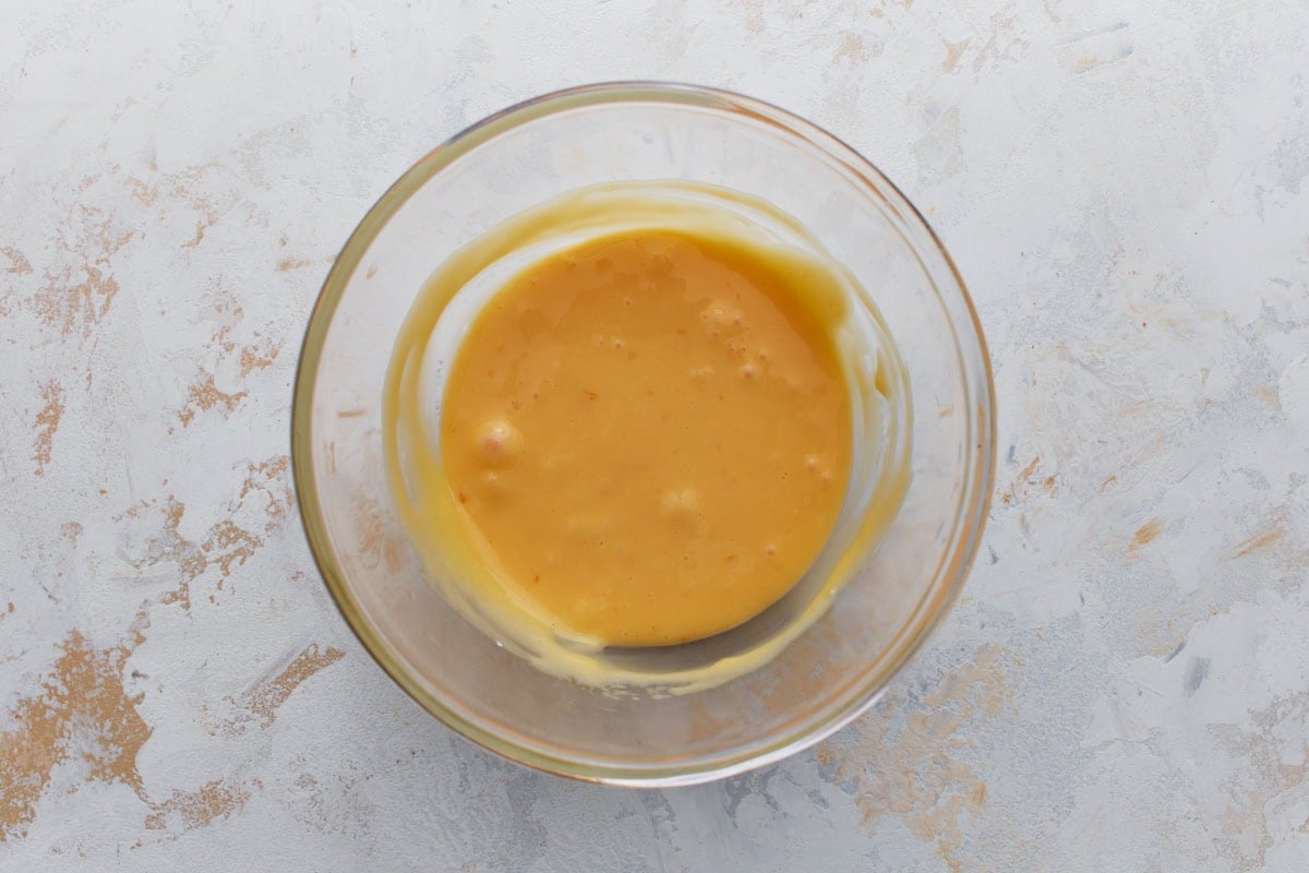 Egg yolks and cornstarch whisked together in a bowl for lemon pie filling