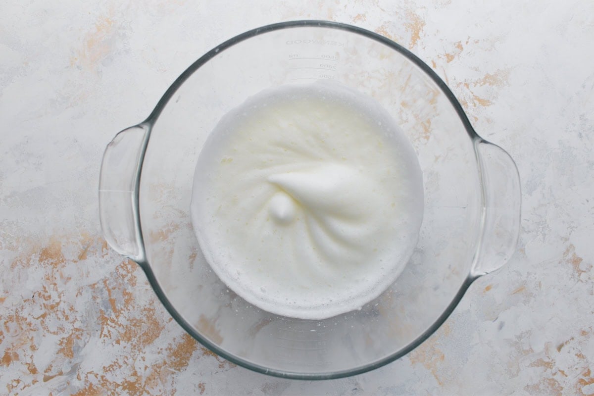 Egg whites whipped with cream of tartar to soft peaks for meringue topping