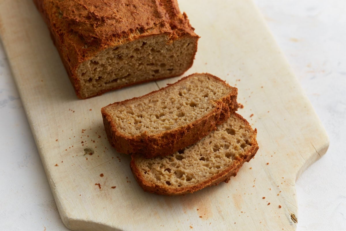 Stacked slices of oat flour bread showing soft interior and slightly dense texture
