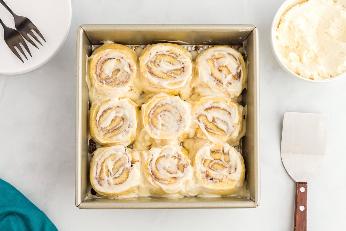 Keto cinnamon rolls baked and topped with cream cheese frosting
