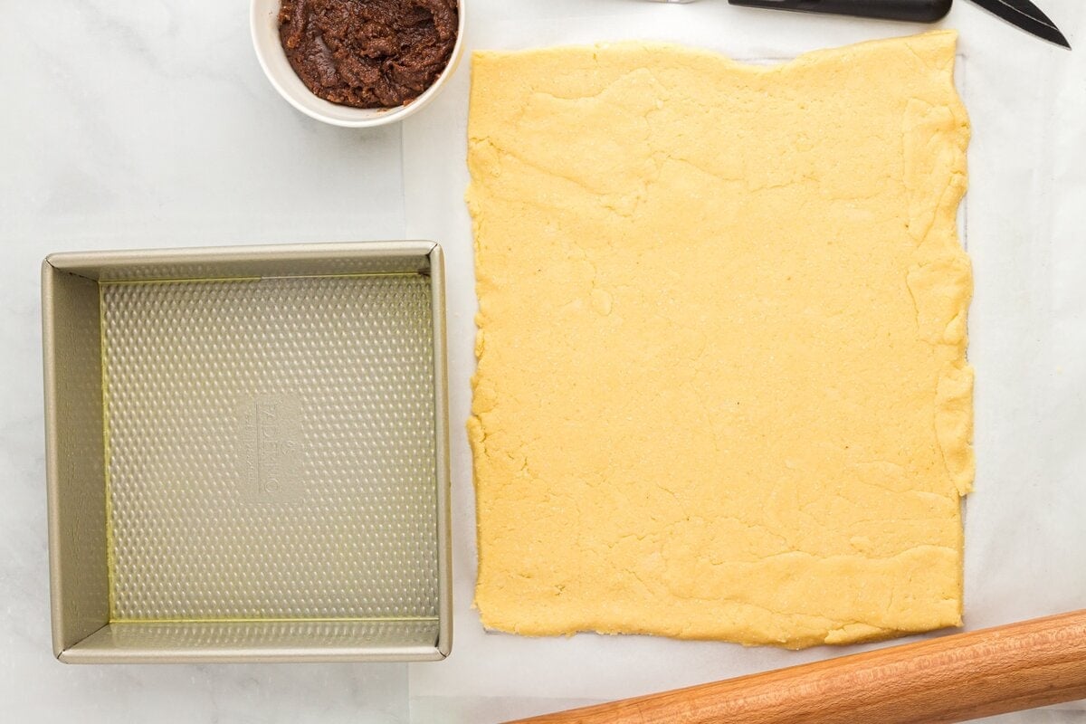 Rolled out coconut flour dough into a rectangle on parchment paper