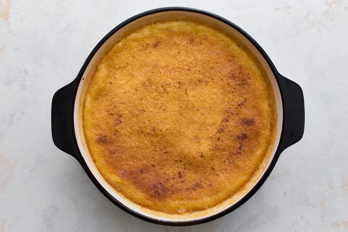 Baked crustless custard pie with a golden brown top in a pie dish