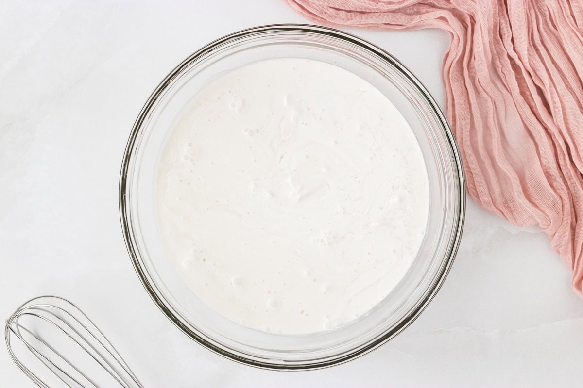 Coconut sorbet base mixed in a glass bowl before freezing.