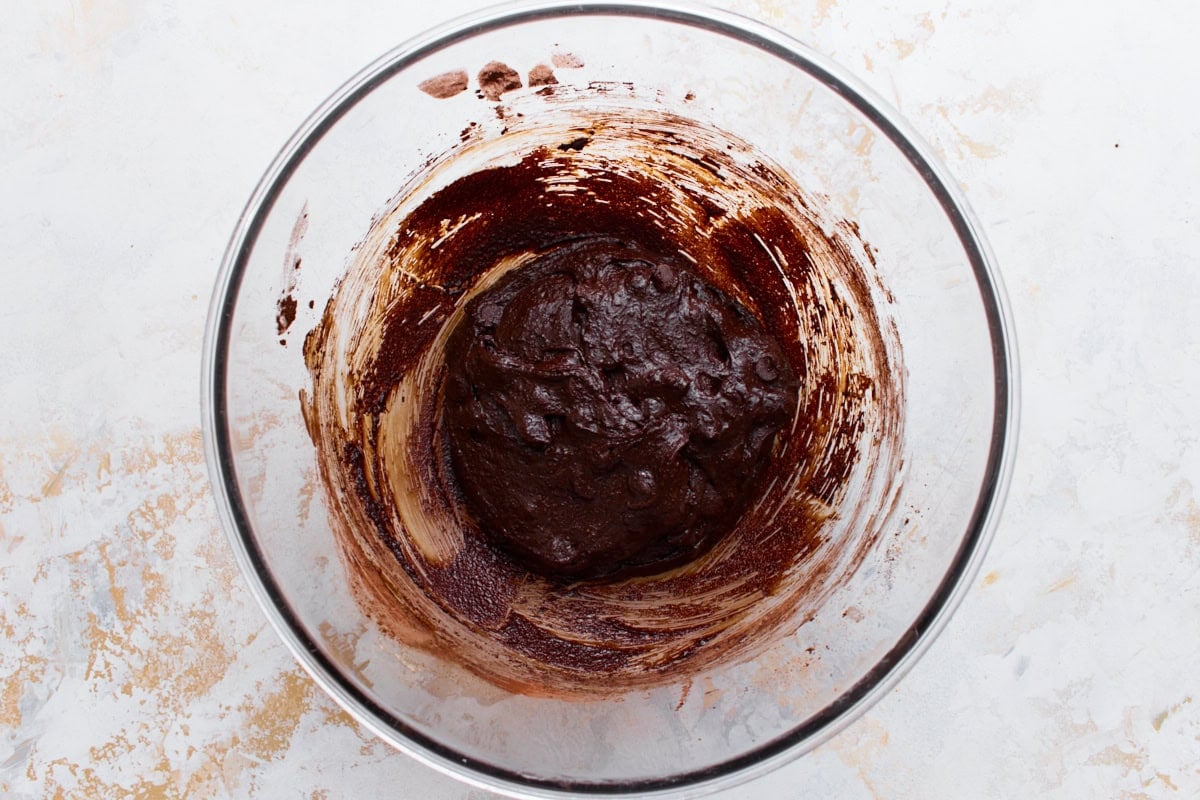 flourless chocolate cookie batter with chocolate chips folded in