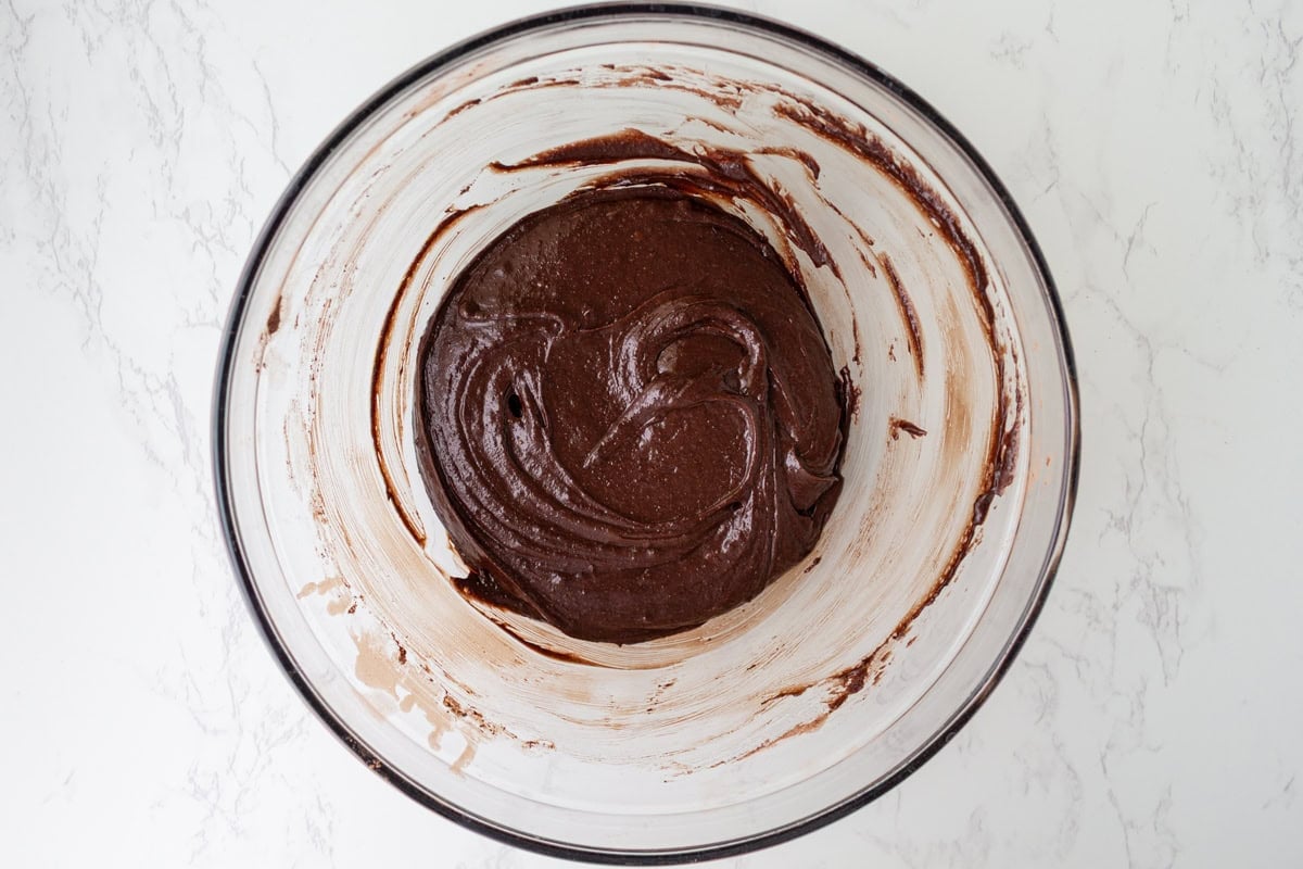 Fudgy gluten-free brownie batter after the cocoa powder, flour, and salt have been stirred in.